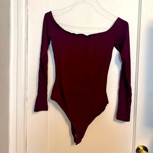 Maroon, off the shoulder body suit.